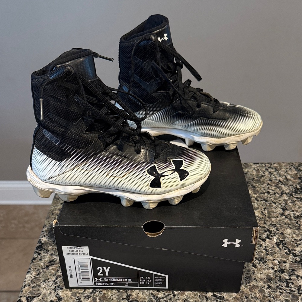 Under Armour UA Kids Black and White Football Cleats 2Y used